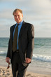 Photo: Attractive business man on the beach Attractive business man on the beach