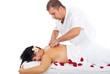 Woman receiving back massage at spa