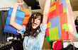 Excited female store bags