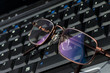 Glasses on laptop keyboard Glasses on laptop keyboard