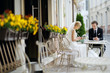 Bride and groom at outdoor cafe