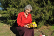 Lucky, an elderly woman holds a lot of gifts Lucky, an elderly woman holds a lot of gifts