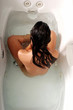 Sexy hispanic woman in the bathtub