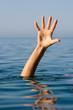 Photo: single hand of drowning man in sea asking for help single hand of drowning man in sea asking for help