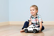 Foto: Cute boy with toy car Cute boy with toy car