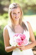 Bride Wearing Dress Holding Bouqet At Wedding Bride Wearing Dress Holding Bouqet At Wedding