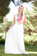 Bride Wearing Dress Holding Bouqet At Wedding Bride Wearing Dress Holding Bouqet At Wedding