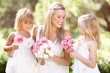 Bride With Bridesmaids Outdoors At Wedding