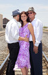 Woman with two men representing a romantic triangle