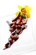 Sliced duck meat with pieces of peach and balsamic sauce