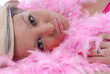 Sexy young woman and pink feather boa