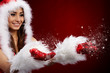 Photo of fashion Christmas girl blowing snow.