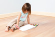 Cute girl paints with pen