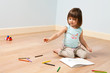 Cute girl paints with pen