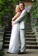 groom hugging his bride