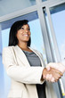 Business woman shaking hands