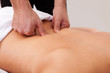 Young beautiful woman getting back massage