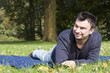Foto: Young Adult Relaxing in the Park Young Adult Relaxing in the Park