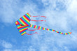 Colorful Kite With Tail Against Blue Sky Colorful Kite With Tail Against Blue Sky