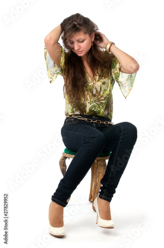 Photo: attractive girl sitting on the chair attractive girl sitting on the chair