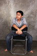 Photo: a man sits on a chair , a man sits on a chair ,