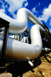 Industrial zone, Steel pipelines and valves against blue sky Industrial zone, Steel pipelines and valves against blue sky