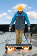 Flat roof covering works with roofing felt