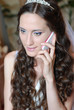 Photo: Beautiful bride with telephone. Beautiful bride with telephone.