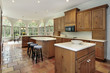 Wood cabinets in kitchen with eating area