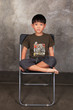 a child sits on a chair