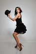 sexy fashion dancing woman in black dress with evening make-up a