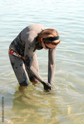 Photo: Washing off Dead Sea Mud Washing off Dead Sea Mud