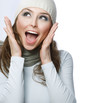 Happy Young Beautiful Woman.Surprised winter Girl over white