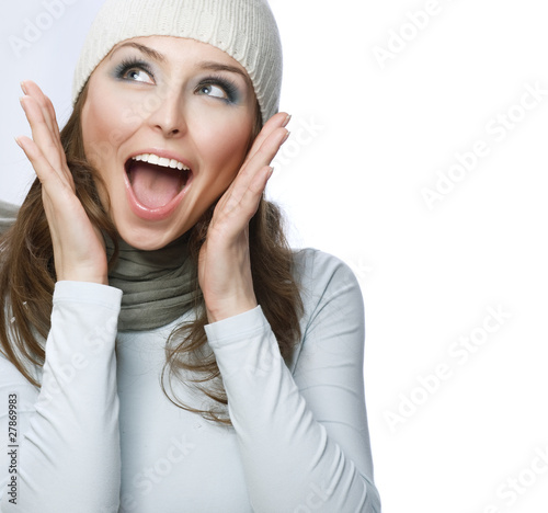 Photo: Happy Young Beautiful Woman.Surprised winter Girl over white Happy Young Beautiful Woman.Surprised winter Girl over white