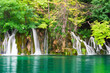 Waterfalls in national park and turquoise lake. Plitvice