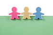 Foto: 3 male figurines on blank paper 3 male figurines on blank paper