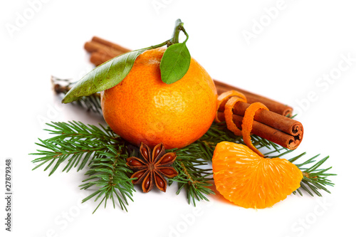 Photo: Mandarin orange, cinnamon, anise and tree branch isolated on whi Mandarin orange, cinnamon, anise and tree branch isolated on whi