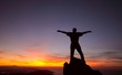 Man on top of mountain.