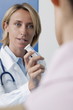 Doctor giving patient medicine