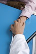Closeup of doctor's hand holding patient's hand