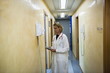 Doctor making telephone call in medical center