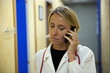 Doctor making telephone call in medical center