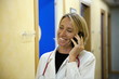 Doctor making telephone call in medical center
