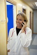 Doctor making telephone call in medical center