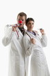 Male and female doctors with party toys