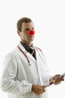 Doctor with stethoscope and clown's nose