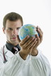 Doctor holding globe