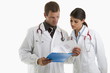 Two doctors looking at medical chart