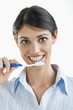 Young woman holding toothbrush
