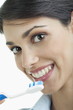 Young woman holding toothbrush